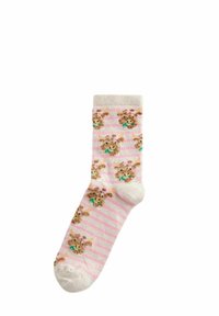 Rosa gestreifte Socken mit hellbeigem Zeh, die ein sich wiederholendes Muster von Cartoon-Tiergesichtern mit Schleifen und bunten Akzenten zeigen.