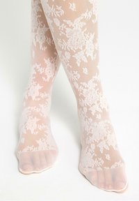 Lace ankle socks in soft pink, featuring a floral pattern, sheer material, and open toe design for added breathability.