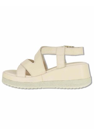 Sandalo beige con zeppa, dotato di cinturini incrociati e chiusura con fibbia, suola texturizzata e sottopiede imbottito per un uso casual.