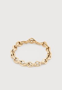 Βραχιόλι με αλυσίδα σε χρυσούς τόνους, με οβάλ και επιμηκυμένο σχέδιο συνδέσμων, τοποθετημένο σε ανοιχτό γκρι φόντο.