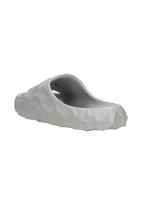 Gray molded clog featuring a geometric, textured surface with open sides and a rounded shape, designed for comfort and breathability.