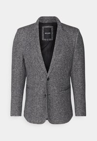 Grijze gestructureerde blazer met een geknipte revers, enkele knoopsluiting en twee voorzakken. De binnenkant is zwart. Het materiaal lijkt geweven.