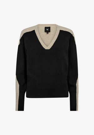 V formos megztinis su ilgomis rankovėmis, pagamintas iš juodos ir smėlio spalvos megztos medžiagos. Pečiuose ir rankovėse yra kontrastingos spalvų blokai.