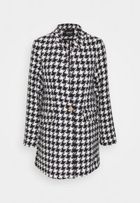 Manteau long à motif pied-de-poule en noir et blanc, doté d'un col, de manches longues et d'un seul bouton doré à la taille.