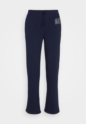 Pantaloni della tuta blu navy con vita regolabile mediante cordino, dotati di un logo ricamato bianco a sinistra, realizzati in morbido tessuto di cotone.