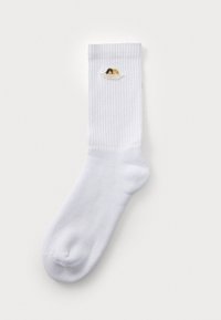 White ribbed sock with a cuffed top, featuring an embroidered design of two figures in a tub near the top. Soft cotton material.