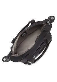 Black handbag with a zippered opening, textured fabric, dual top handles, and an internal logo tag. The interior is a light gray.