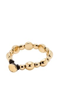 Pulsera de cuentas doradas con formas ovaladas variadas, textura suave, banda elástica y un pequeño disco con la marca como detalle.