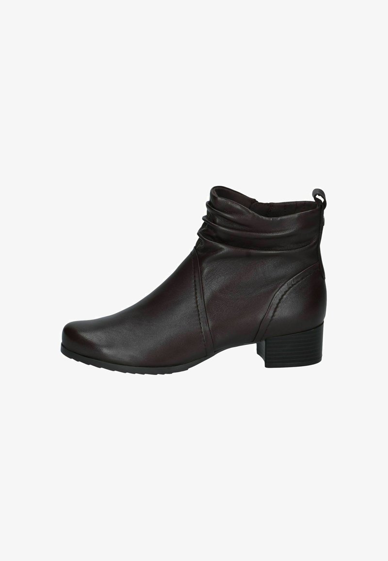 Bottine en cuir marron foncé avec petit talon bloc, détail supérieur ample et languette à l'arrière, vue de profil.