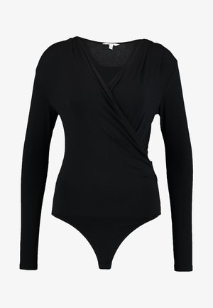 Musthave mustriga bodysuit, millel on puhas tekstuur ja sügav V-kaelus. Alus on stringikattega.