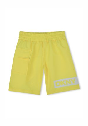 Shorts jaunes en matière légère, dotés d'une taille élastique, d'une poche latérale et d'un logo DKNY blanc au bas sur le devant.
