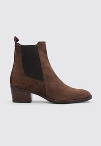 Brown suede ankle boot with a black elastic side panel, pointed toe, and a stacked heel. Features a pull tab for easy on/off.