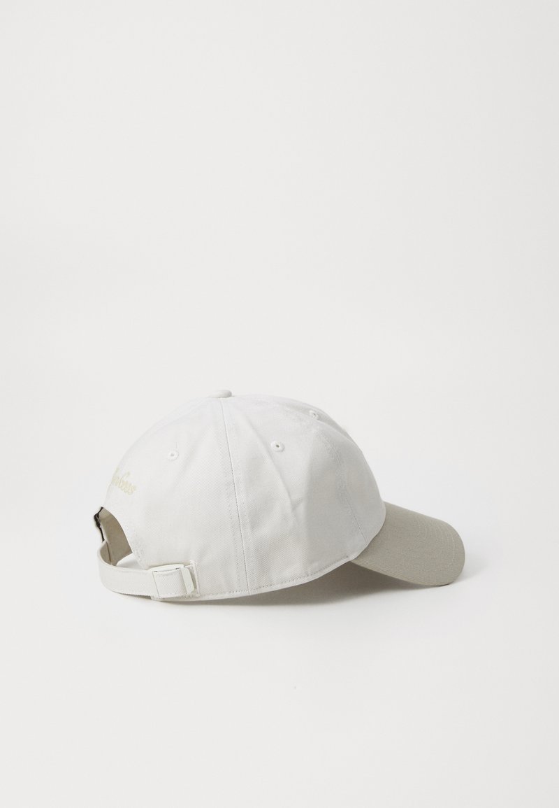 White cotton baseball cap with a curved visor, adjustable strap, and embroidered logo on the back. Smooth texture, minimalist design.