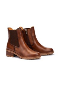 Braune Leder-Stiefeletten mit strukturierten elastischen Seitenteilen und einem Reißverschluss. Robuste Gummisohle mit niedrigem Absatz für guten Halt.