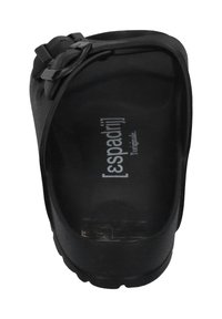 Black slip-on shoe with a textured finish, featuring a broad strap with a buckle accent. Interior displays brand name in white lettering.