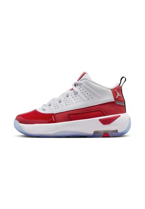 Red and white athletic sneakers with a smooth leather upper, ventilated sides, and a translucent rubber sole. Features black heel accents.