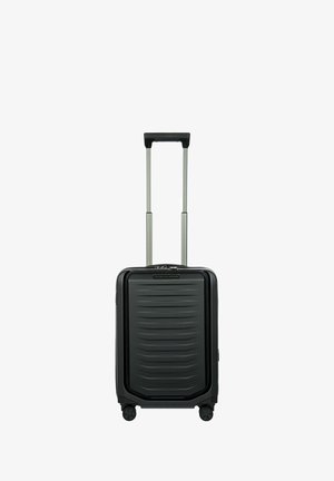 Zwarte harde koffer met een gestructureerde oppervlakte, een telescopische handgreep en vier wielen voor mobiliteit. Voorzien van zilveren ritsen en accenten.