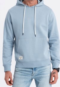 Ljusblå hoodie i blandning av bomull, med en framficka, snoddar med svarta aglets och ribbade ärmslut och nederdel.