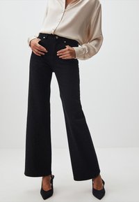 Jimmy Key WIDE LEG SHINY STONES - Jeans a zampa - black