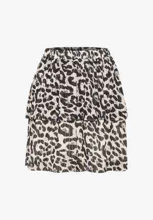 Jupe plissée noir et blanc présentant un design superposé avec un motif léopard et une taille élastique.