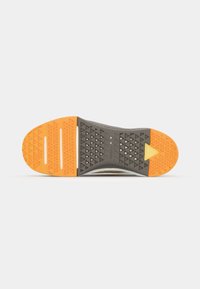Shoe sole with a textured design; gray rubber with an orange and yellow accent. Features triangular patterns for traction.