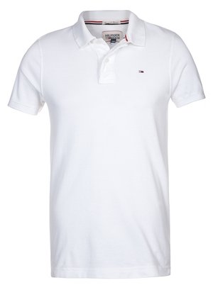 Polo blanc à manches courtes avec col et patte à deux boutons, avec petit logo drapeau Tommy Hilfiger sur la poitrine gauche.