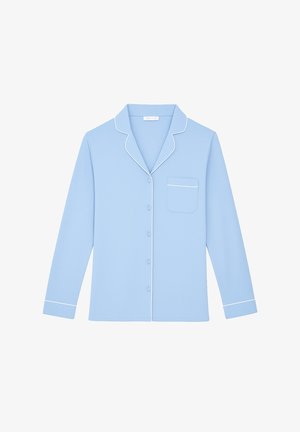 Light blue button-up pajama top with long sleeves, white piping along the collar and pocket, and a single chest pocket. Soft fabric texture.