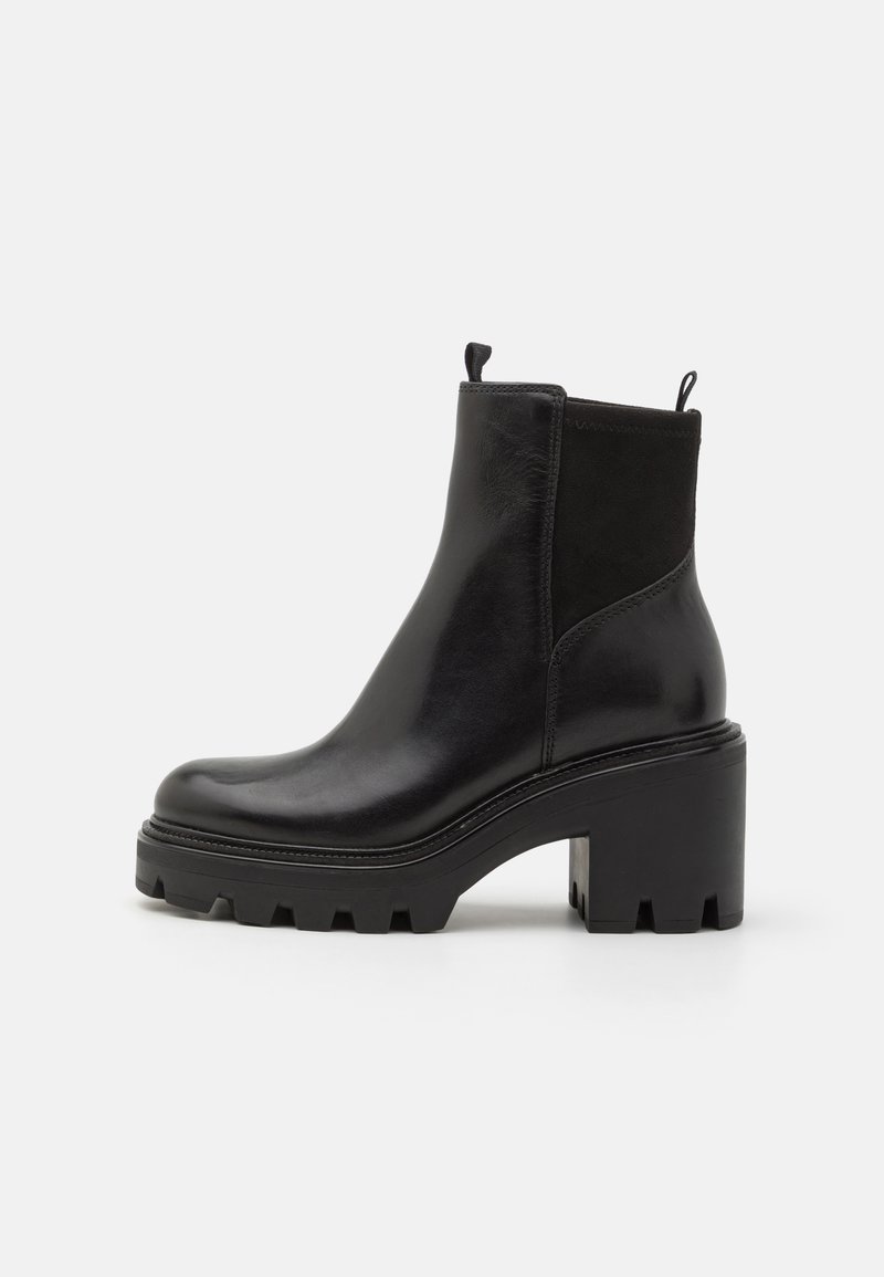 Black leather ankle boots with a chunky heeled sole, elastic side panels, and pull tab; sleek design with textured accents.