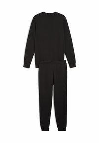 Sort loungewear sæt bestående af en langærmet top og bukser. Blødt stof, ribbede manchetter og en elastisk talje. Minimalistisk design.