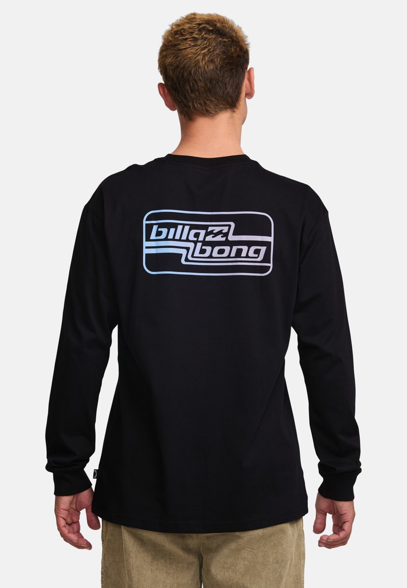 Black long-sleeve shirt with a large blue and white Billabong logo on the back. Made from a soft fabric with a regular fit and smooth texture.