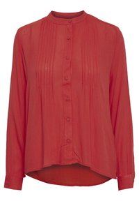 Blouse rouge à manches longues avec un col mandarin, présentant des plis verticaux et des boutons sur le devant. Tissu doux et léger avec une coupe décontractée.
