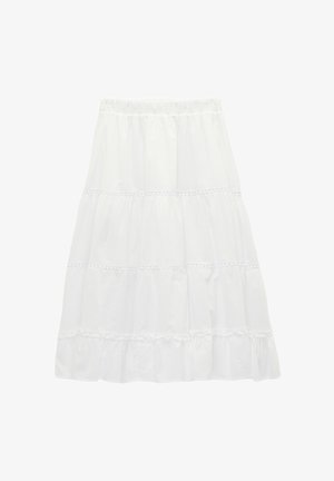 Jupe blanche à volants avec ceinture élastique et détails subtils en dentelle sur chaque volant, fluide et longueur genou.