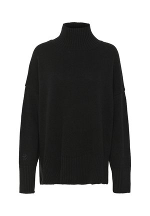 Black knit turtleneck sweater with a loose fit, ribbed neckline, and cuffs. Features a textured pattern on the body and logo detail on the sleeve.