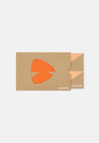 Zalando card holder made of brown cardboard with an orange cutout. Features an internal slot for a card, minimal design elements.