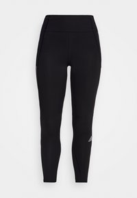 Schwarze Sportleggins mit hoher Taille, glatter Textur, subtilen Seitenpaneelkonstruktionen und einem kleinen weißen Logo am unteren Bein.