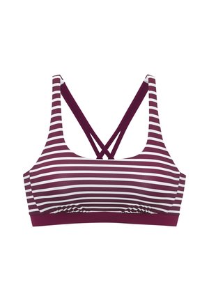 Trenirko z belimi in temnordečimi črtastimi horizontalnimi črtami ter križno prepletenimi temnordečimi naramnicami na hrbtu.