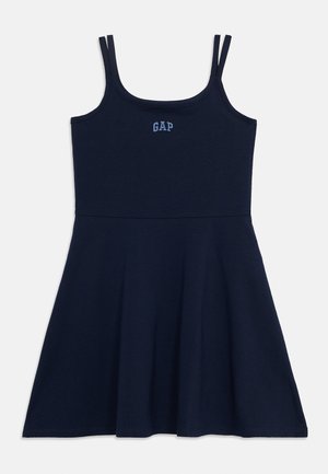 Φόρεμα σε ναυτικό μπλε χωρίς μανίκια με λεπτές τιράντες, εφαρμοστό μπούστο, φούστα που ανοίγει και κεντημένο λογότυπο "GAP" στο στήθος.