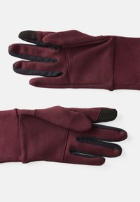 Bordo pirštinės su minkštu, tekstūruotu paviršiumi ir juodais lietimui jautriais galiukais. Rankogaliai yra elastingi, todėl puikiai priglunda.