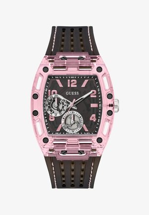 Orologio trasparente rosa con cassa rettangolare, quadrante nero, ampie marcature numeriche e cinturino in gomma marrone con ritagli. Presenti due sottodial.
