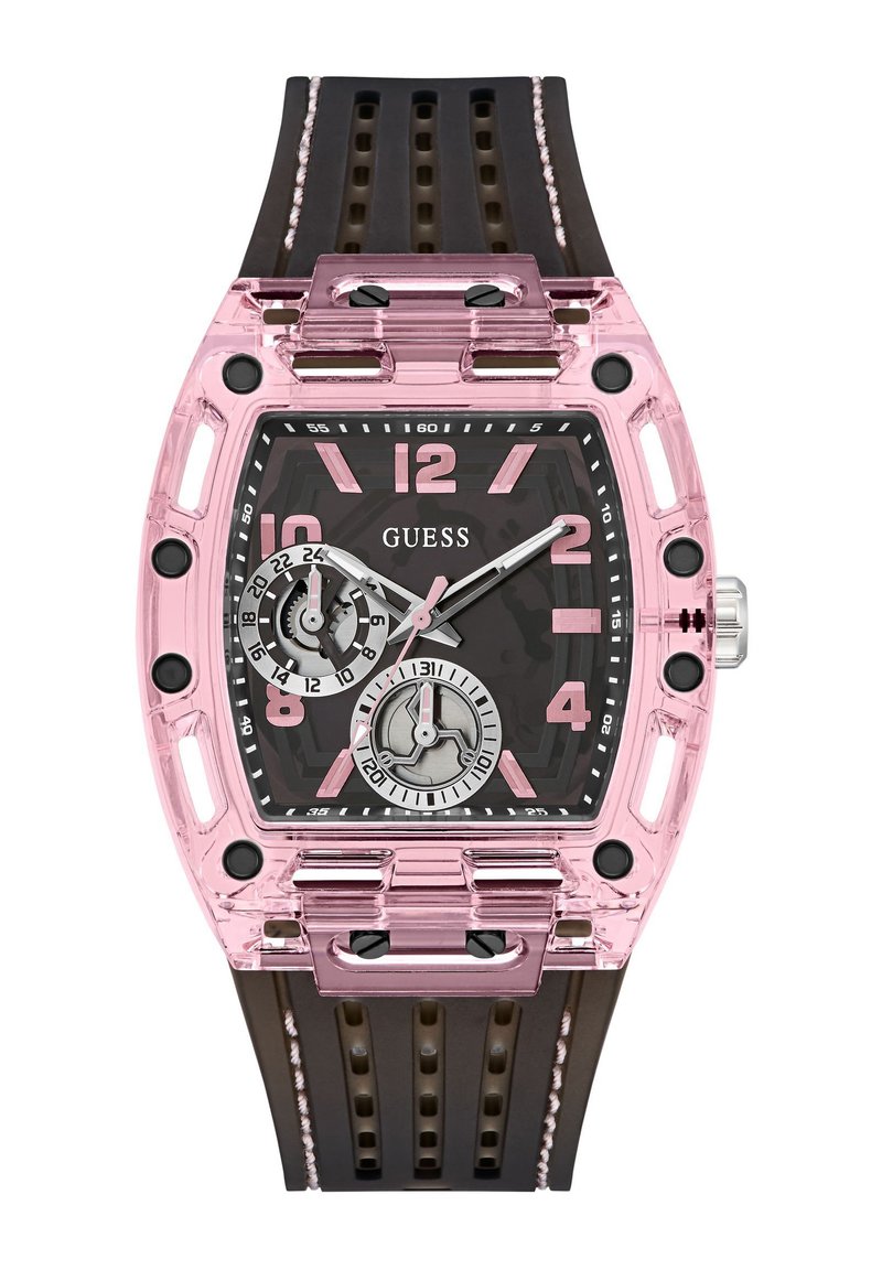 Montre transparente rose avec un boîtier rectangulaire, un cadran noir, de grands marqueurs numériques et un bracelet en caoutchouc brun avec des découpes. Deux sous-cadrans présents.