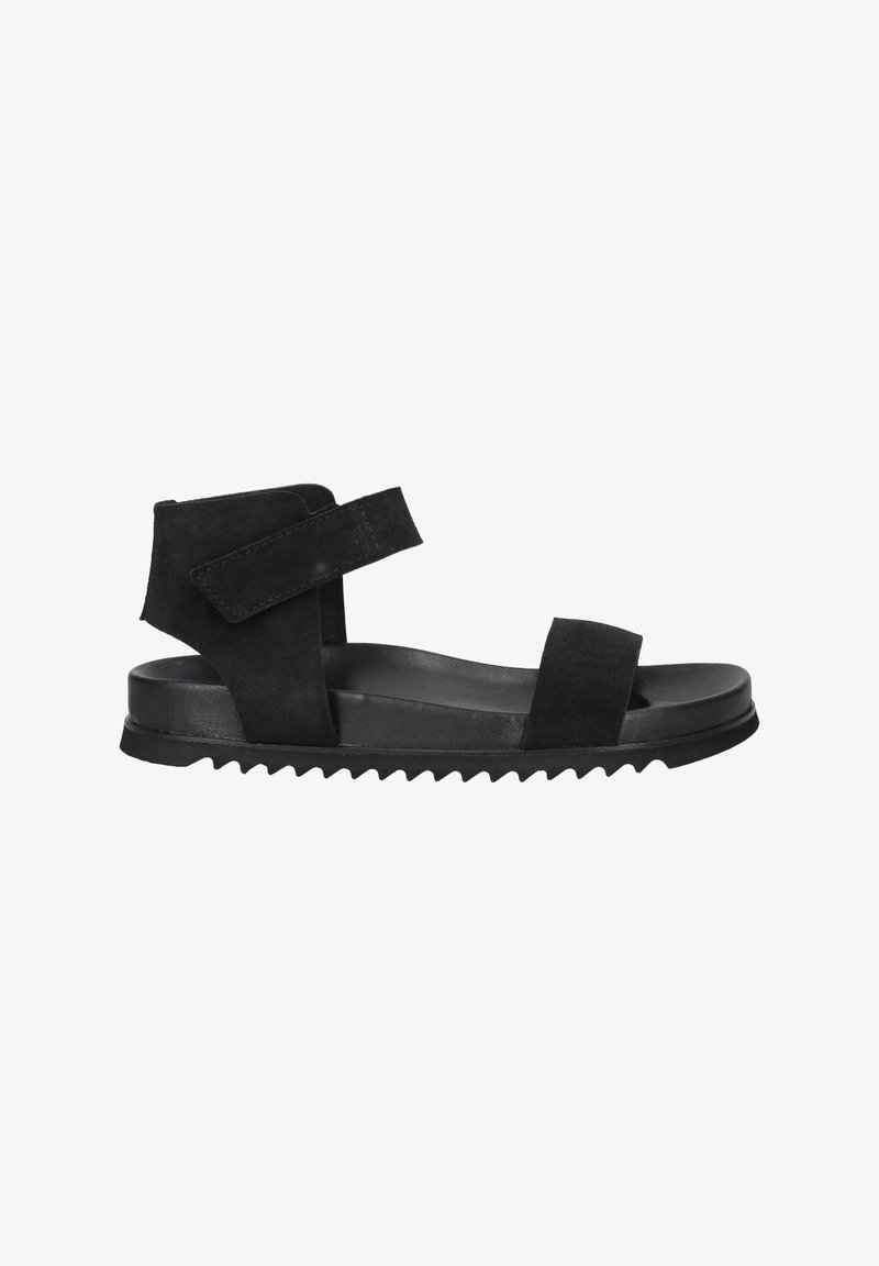 Black suede sandal with two wide straps, adjustable Velcro, and a contoured sole featuring textured grooves for grip.