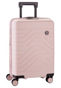 Valigia rigida color rosa chiaro con motivo a onde, dettagli neri, manico telescopico e quattro ruote girevoli per una facile mobilità.