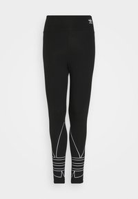 Svarta leggings med hög midja, prydda med vita geometriska mönster och accentlinjer. Tillverkade av stretchigt tyg för komfort.