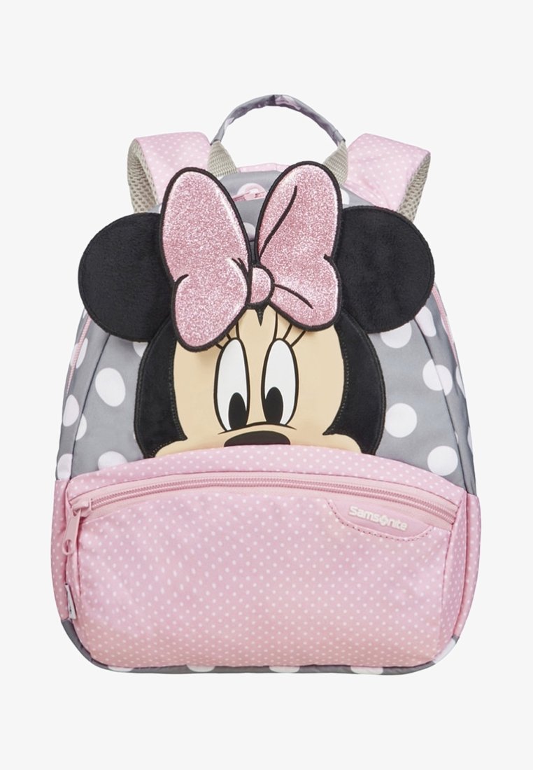 Sac à dos pour enfants avec visage de Minnie Mouse, grand nœud rose pailleté, oreilles noires, pois roses et blancs, poche avant zippée et bretelles rembourrées.