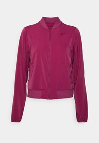 Chaqueta bomber de mujer de manga larga, con cremallera, en rosa profundo, con puños y cuello acanalados, que presenta un pequeño logo de Nike en el pecho.