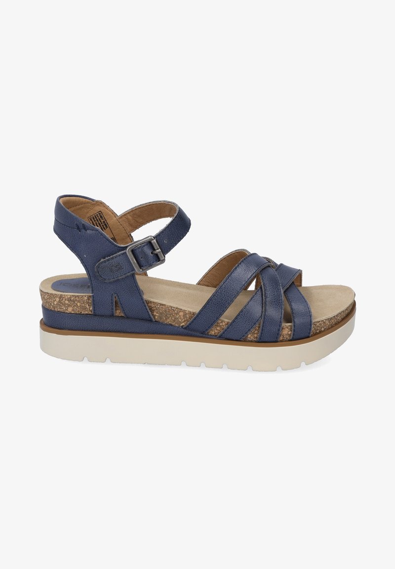 Navy blue sandal with multiple overlapping straps, cork footbed, and a white rubber sole. Features an adjustable buckle on the ankle strap.
