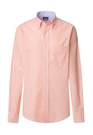 Koszula z długim rękawem zapinana na guziki w jasnopomarańczowym materiale. Posiada kołnierz, kieszonkę na piersi oraz kontrastowe, niebieskie wykończenie wewnętrzne kołnierzyka.