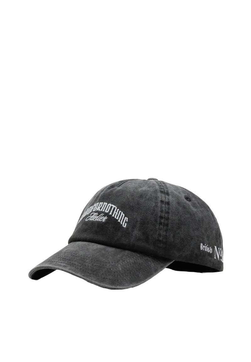 Black cotton baseball cap with a curved brim. Features white embroidered logos on the front and side. Textured fabric with a worn look.