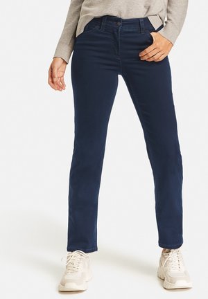 Navy blue jeans with a slim fit, made from a stretchy material. Features front pockets, belt loops, and a single button closure.