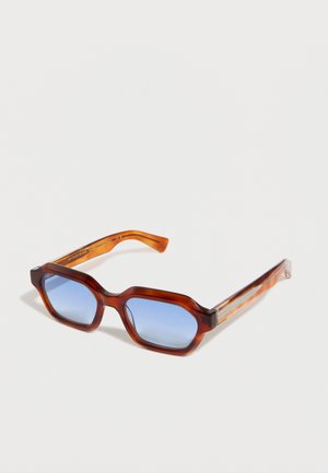 Tortoiseshell rectangular sunglasses with thick frames and blue tinted lenses on a white background.